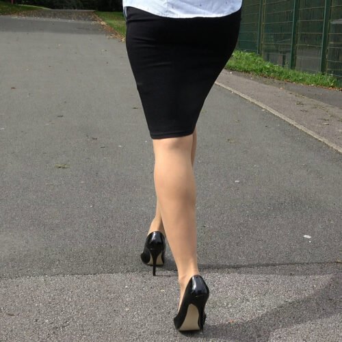pretty lady wears black shiny heels