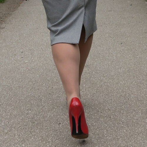 smart attractive lady wears classic styled red heels