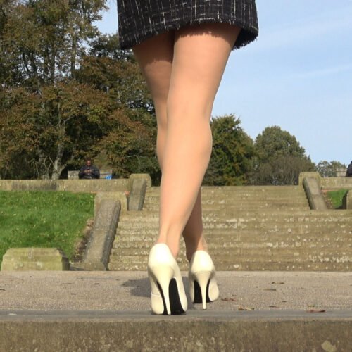 Tottering in White Essex Girl heels