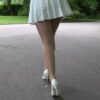 pretty girl wears white pointed heels